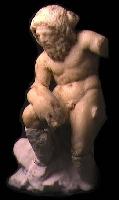 Statuetta di Nettuno, seduto con in mano un delfino. Proviene da Cartagine (Ora al Museo del Bardo)