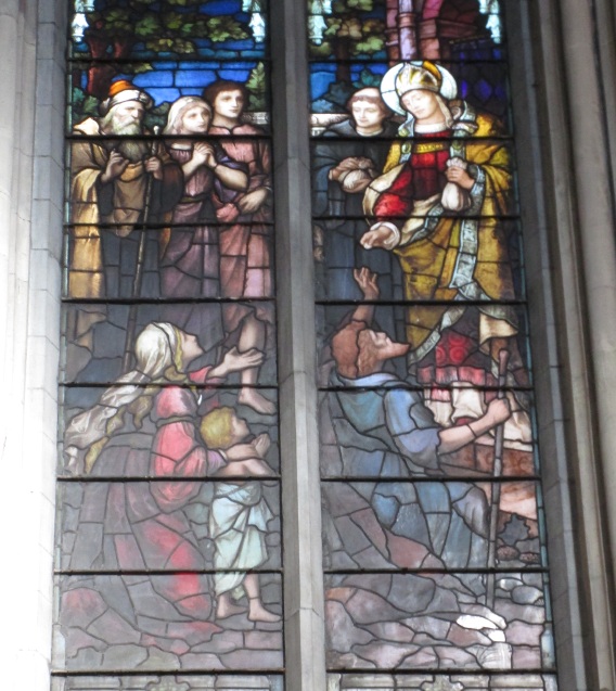 San Tommaso da Villanova fa l'elemosina ai poveri: vetrata della chiesa agostiniana di Dublino con scene agostiniane