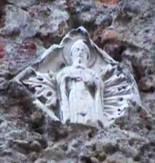 Agostino vescovo scolpito nel muro dell'omonimo stradone a Genova