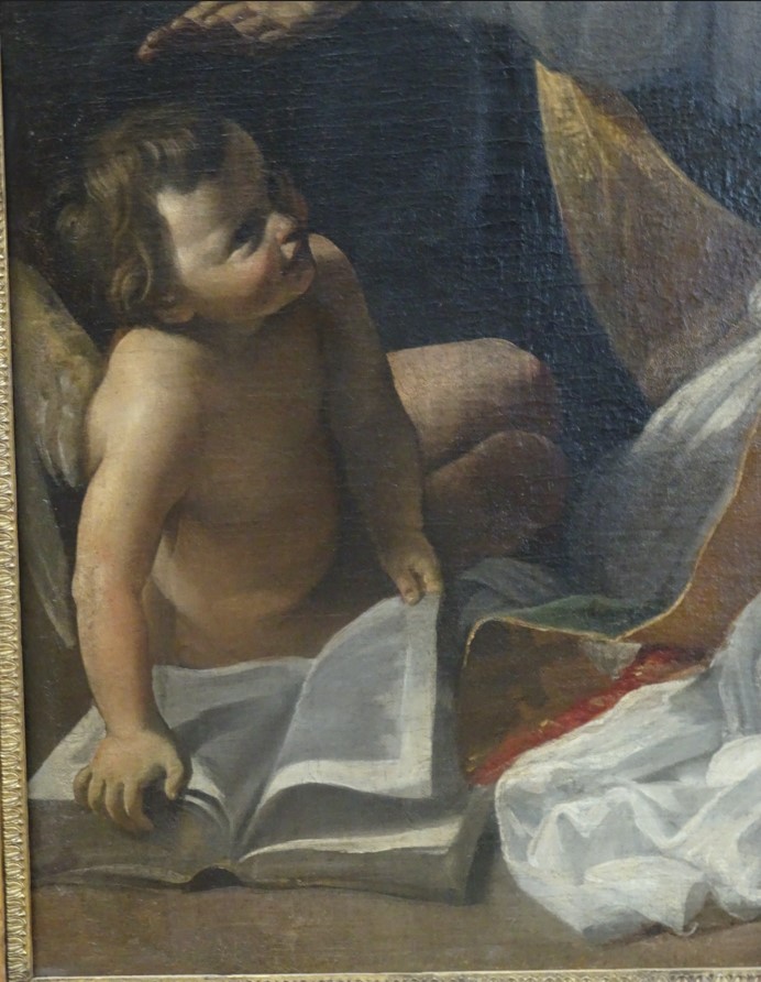 Particolare dell'angelo bambino seduto ai piedi di Agostino