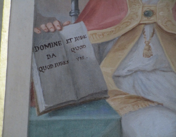 Agostino vescovo e cardioforo nella chiesa di S. Bartolomeo a Barzago: Particolare della scritta sul libro in mano ad Agostino